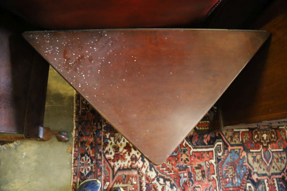 A George III triangular mahogany pad foot drop leaf table, width 90cm, depth 46cm, height 70cm